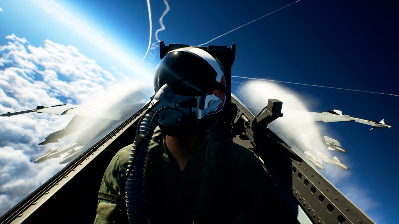 ACE COMBAT 8: WINGS OF THEVE official screenshot: cockpit view over a burning coastal battlefield at dusk