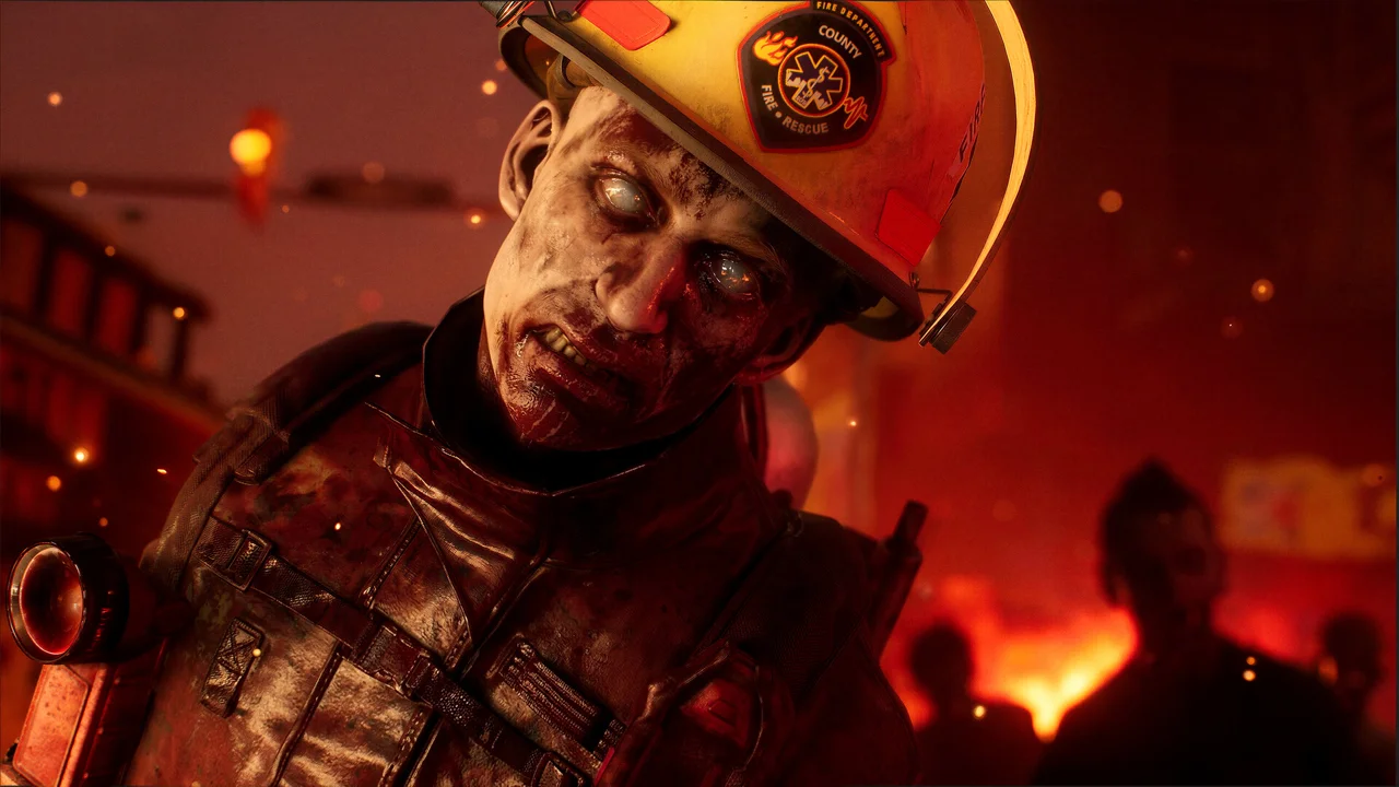 No More Room in Hell 2 gameplay: a group of survivors moving through a street full of zombies, flashlights on, weapons raised
