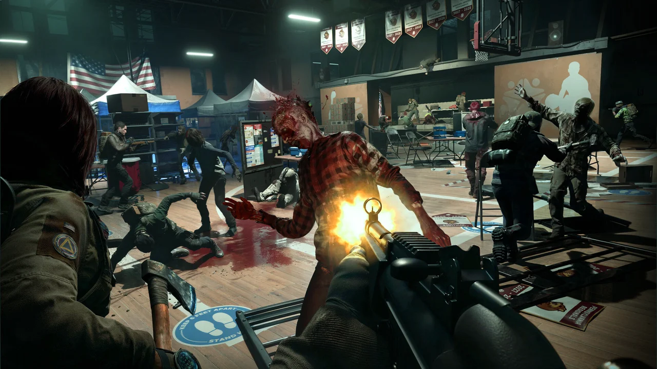 No More Room in Hell 2: a survivor using melee on a zombie in close quarters, with blood and flashlight beams